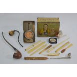 A selection of smoker's collectables and other items, including long-stemmed pipe with silver band,