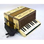 A Hohner Student 1 cream marbled piano accordion
