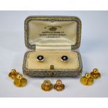 A pair of 18ct and platinum diamond set studs with onyx centres, cased,
