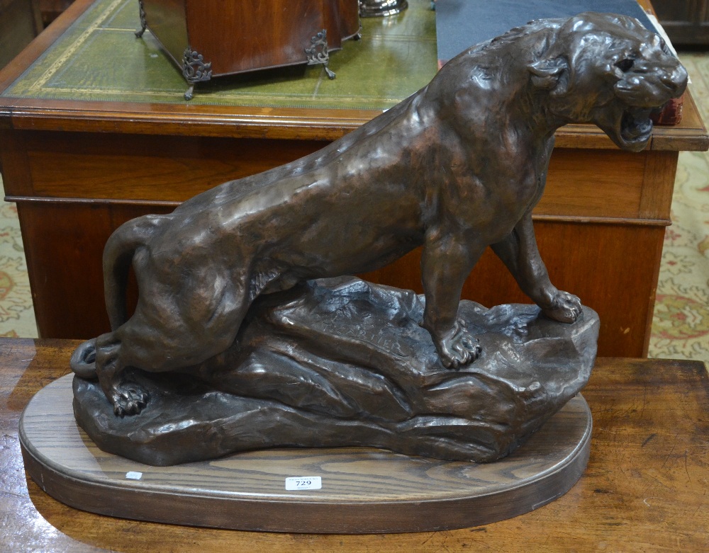 A large contemporary bronze finished composite cast sculpture of a puma,