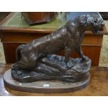 A large contemporary bronze finished composite cast sculpture of a puma,