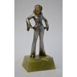 An Art Deco gold and silver patinated bronze figure of a clown girl with empty pockets in the