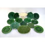 A collection of mainly Victorian green majolica leaf moulded plates including a set of six