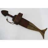 An African Tebu dagger with 29 cm broad engraved blade,