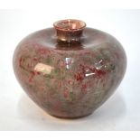 A mottled sang-de-boeuf/lang-yao style vase with green inclusions, oviform body and short,