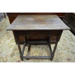 A 17th century oak side table with frieze drawer,