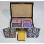 A Victorian walnut playing cards box, the domed lid mounted with brass and ivorine,