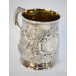 A Georgian silver half-pint baluster mug, later floral and foliate embossed,