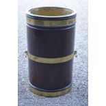 An unusual George III style oversize brass bound mahogany peat bucket,