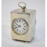 A Victorian silver desk-clock with brass movement and enamel dial, the case Wright & Davies,