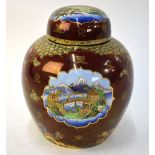 An unusual Carlton Ware red lustre ginger jar and cover decorated with stylised pine trees, rocks,