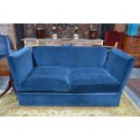 A classic country house Knole sofa, upholstered in blue velvet,