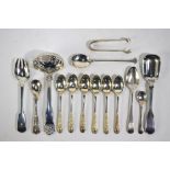 A quantity of flatware, including William IV fiddle, thread and shell sifter ladle with oval bowl,