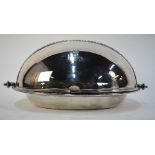 An unusual Victorian oval plated on copper entree dish with hinged 'eyelid' cover and two liners