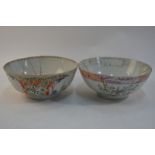 Two Chinese Export punch bowls: the larger in famille rose decorated with elegant Manchu/Chinese