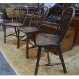 A trio of similar 19th century West Country elm seat side chairs,