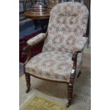 A Victorian rosewood framed button backed open armchair,