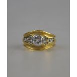 An 18ct yellow gold textured band ring, diamond set centre approx 0.