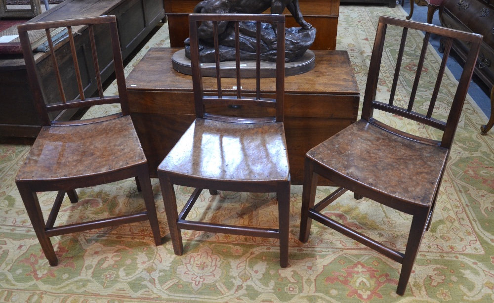 A set of three 18th/19th country fruitwood side chairs each having a shaped single piece pollard