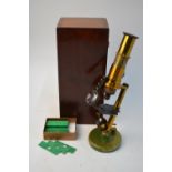 A French Swiss lacquered brass microscope, in fitted mahogany box,