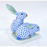 Herend Porcelain model of a pair of hares seated on a shaped base,