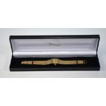 A lady's 9ct gold Longines wristwatch, the 17 jewel movement with champagne tonneau dial,