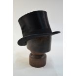 A vintage black silk top hat retailed by Herbert Johnson, 38 New Bond St., London W - 57.5 cm circ.