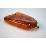 A piece of amber having yellow gold pendant fitting containing three insects, approx 5 x 4.