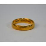 A 22 ct court style wedding band, size L, approx 4.