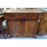 A Victorian mahogany side cabinet having a full width frieze drawer over a pair of panelled