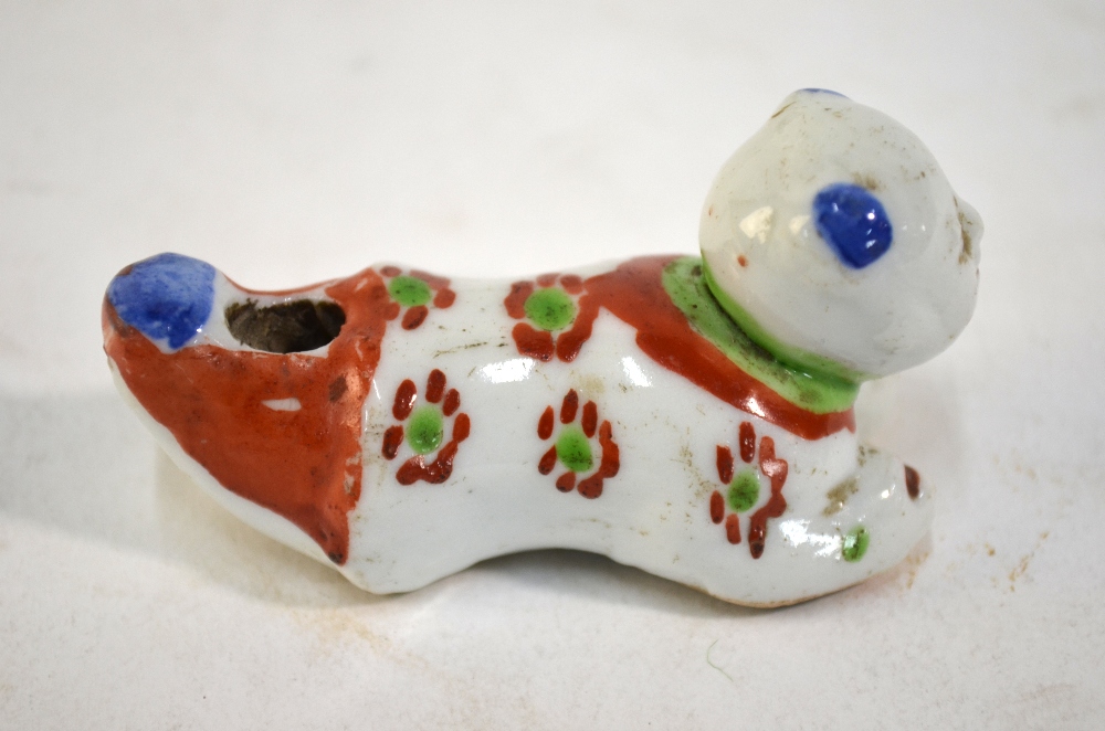 A scarce porcelain whistle designed as a recumbent karako with unglazed base; decorated in blue, - Image 3 of 4