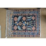 A Persian nahavand rug, the symmetrical design on dark ground within red and blue borders,