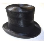A black silk top hat retailed by Lock & Co, Hatters, St. James St., London, 58 cm circ., 20.