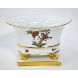 Herend porcelain oval bowl on four gilded lion paw feet raised on a rectangular base,