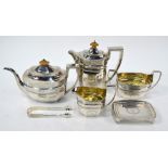 A matched silver five-piece tea service of elongated octagonal form with engraved decoration,