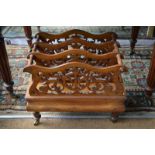 A Victorian four division fret-cut Canterbury with waisted drawer beneath,
