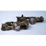 A companion pair of Scottish 18th century plaited hairwork bracelets one having a miniature