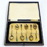 An Art Deco cased set of six silver gilt and Harlequin enamel coffee spoons, Deakin & Francis,