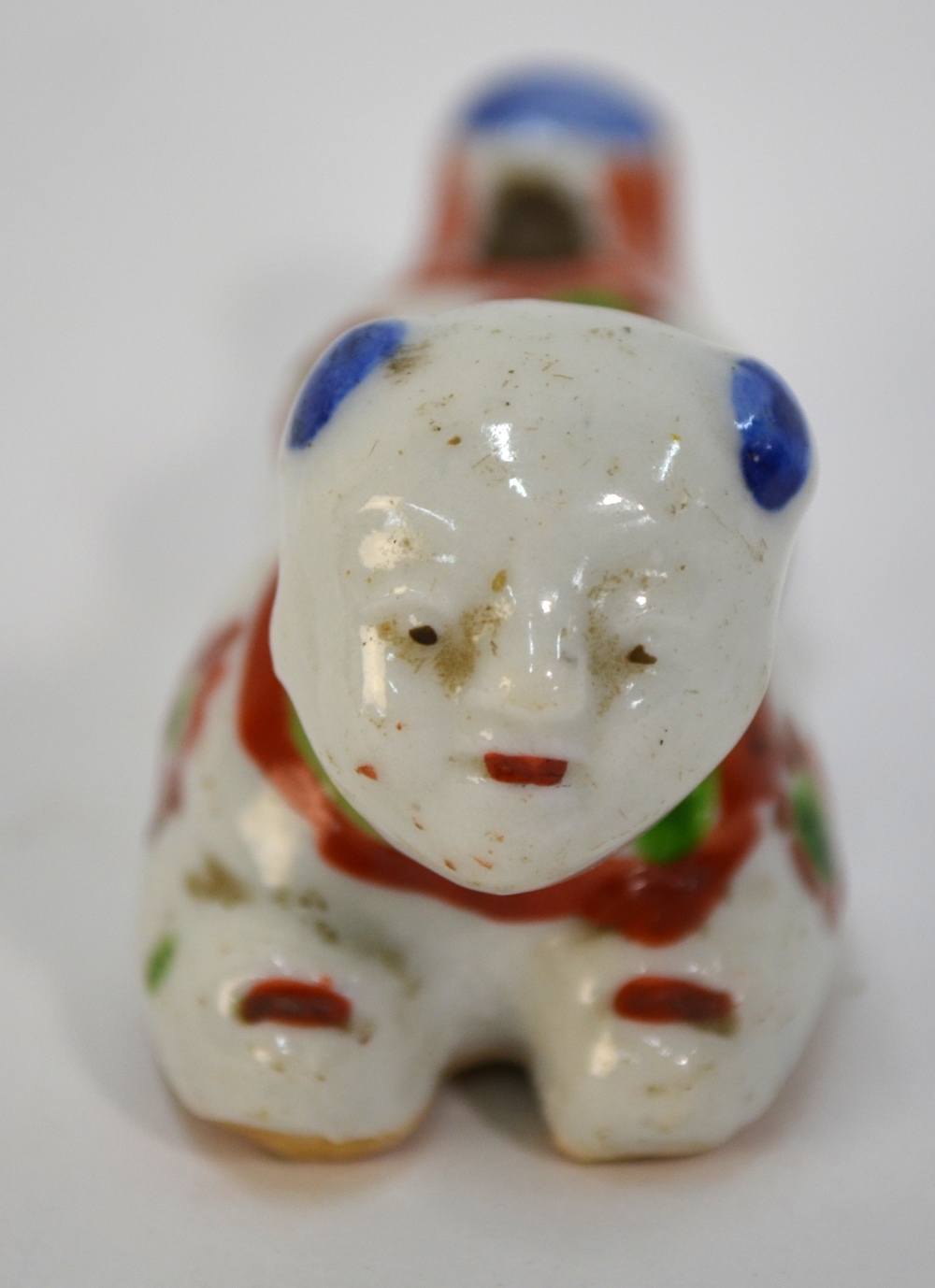 A scarce porcelain whistle designed as a recumbent karako with unglazed base; decorated in blue, - Image 2 of 4