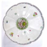 A famille rose 'egg-shell' bowl, decorated with dragon and floral designs, 27cm diameter,