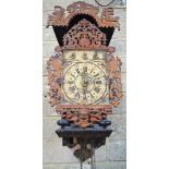 A antique Dutch Stoelklok, the bell striking alarm movement with brass pillars,