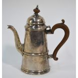 A heavy quality small silver coffee pot of tapering form with domed cover,