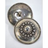 A Dutch 833 grade cloak-clasp, as two outsize button-bosses with star centres, beading,
