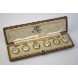 A set of six engraved mother of pearl dress buttons,