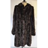 A mink fur stole with scalloped edges, mink collar, a pair of cuffs with four mink tails on each,