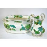 A Victorian Staffordshire foot bath painted with passion flowers and foliage to/w a matching water