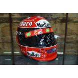A 2001 Formula I motor racing replica crash helmet (Bell) signed to the visor by Michael Schumacher,