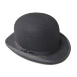 A bowler hat retailed by Lock & Co Hatters, St. James' St., London - 55 cm circ., 19.
