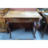 An 18th century fruitwood side table, the two plank top over a pair of frieze drawers,