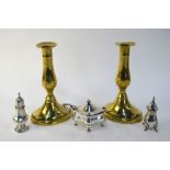 Two silver pepper pots and a mustard, 4 oz, to/w a pair of antique brass candlesticks,